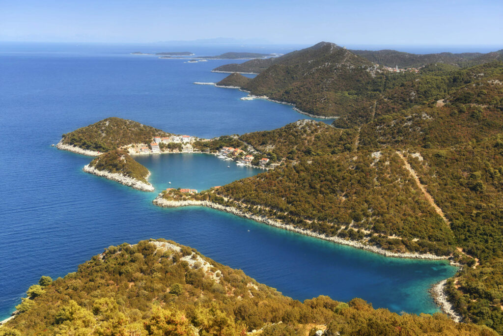 Aerial view of Lastovo National Park: A picturesque archipelago with pristine islands surrounded by clear blue waters.